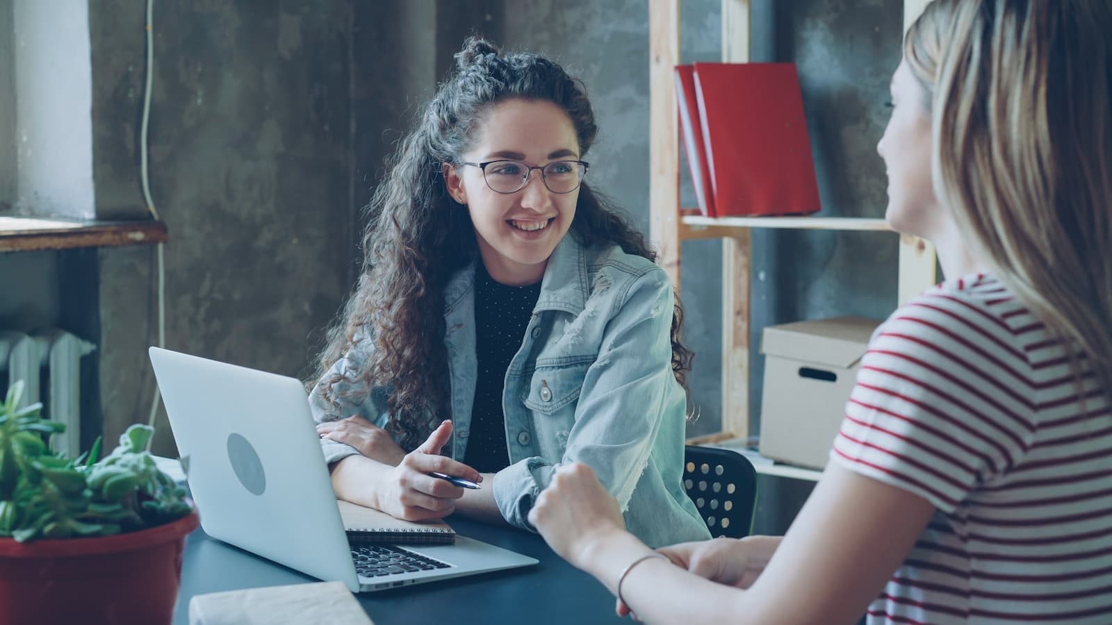 Two business professionals mapping a workflow together
